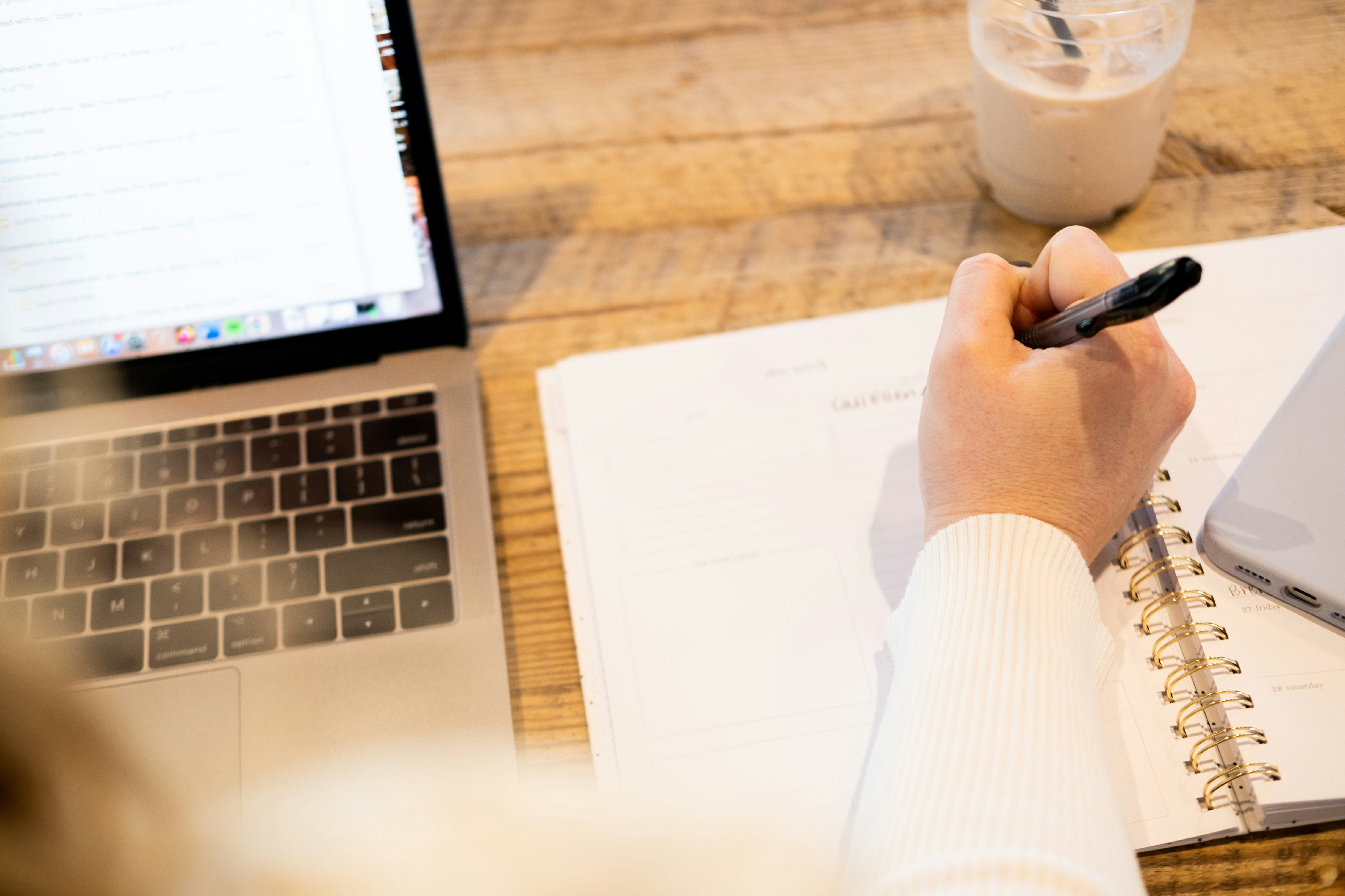 A planner open on a desk — representing the limits of a 24-hour scheduling model for women